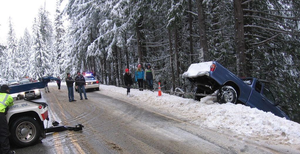 Roadside rescue on winter Colorado roads with snow and ice
